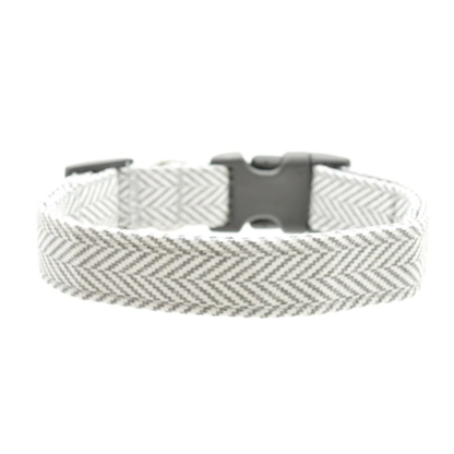 Woven herringbone dog collar with a black buckle on a white background