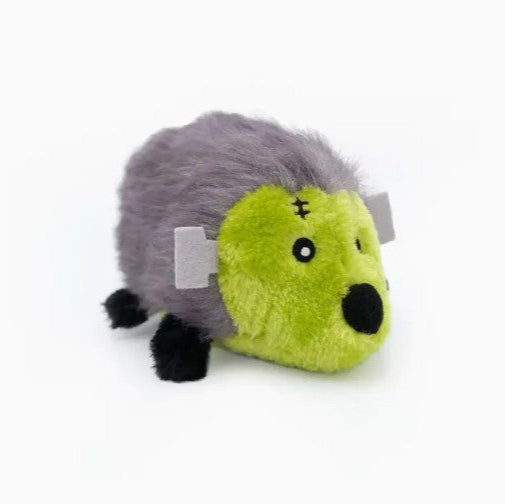 Plush toy resembling a hedgehog with green body and gray back on a white background