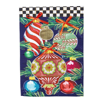 Decorative Christmas-themed garden flag with colorful ornaments and ribbons on a checkered background