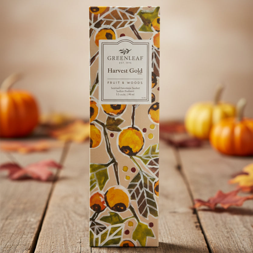 Greenleaf Harvest Gold slim sachet on a rustic fall table with small pumpkins in the background.