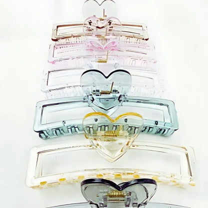 Stack of heart-shaped hair clips on a white background