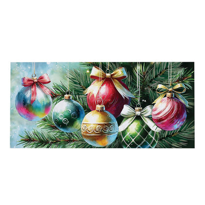 Colorful Christmas ornaments with ribbons hanging on a branch