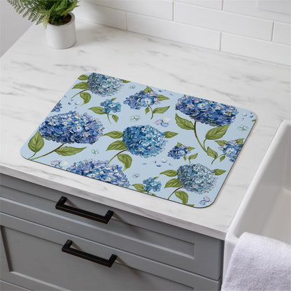 Hydrangea Haven Dish Drying Mat with blue hydrangea design on a marble kitchen counter.