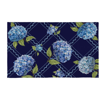 Hydrangea Haven door mat with blue hydrangea design on navy background.