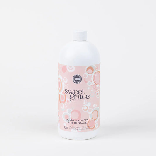 Bottle of Sweet Grace laundry detergent on a white background
