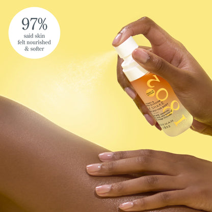 Hand applying a skincare product to skin with a yellow background