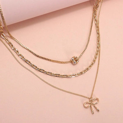 Multi Layer Pearl Bow Charm Necklace