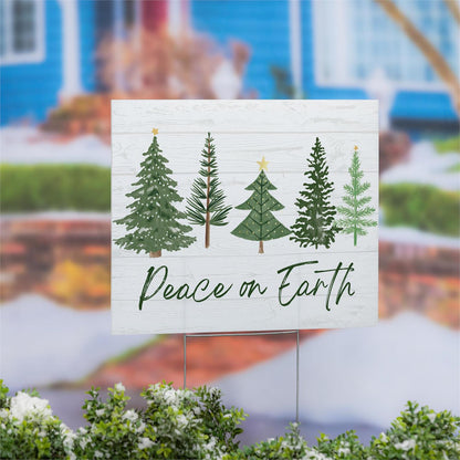Christmas-themed sign with trees and 'Peace on Earth' text in front of a blurred outdoor background.