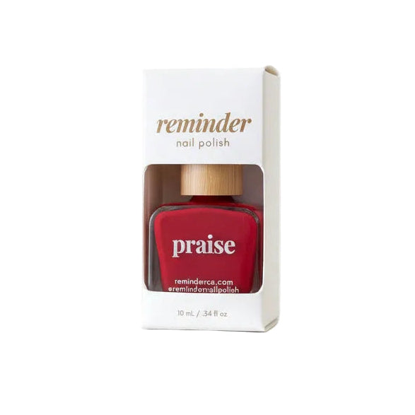 Bottle of Reminder Nail Polish in Praise Classic Red on a white background