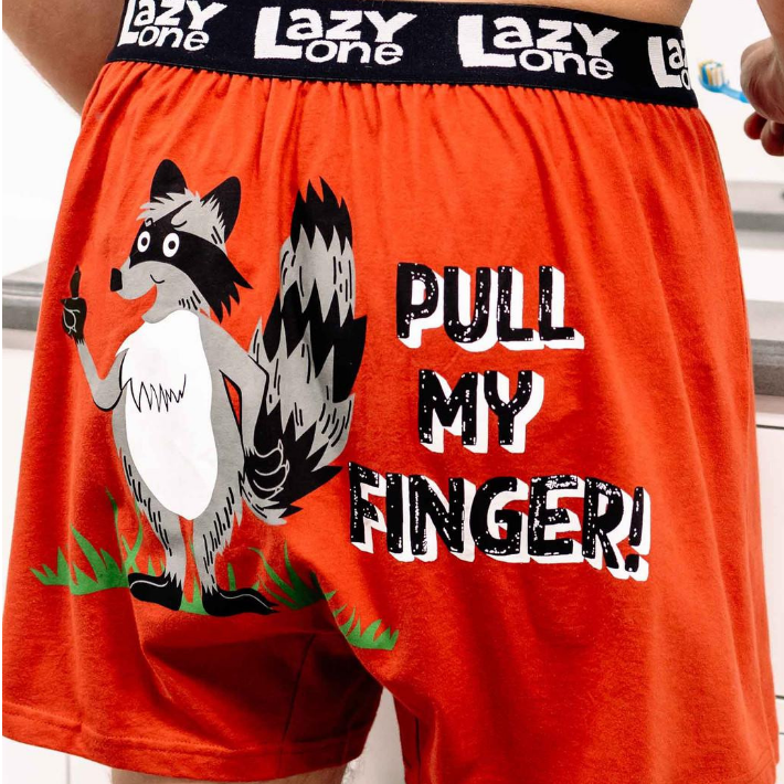 Red boxer shorts with a cartoon raccoon and text 'Pull My Finger!' 