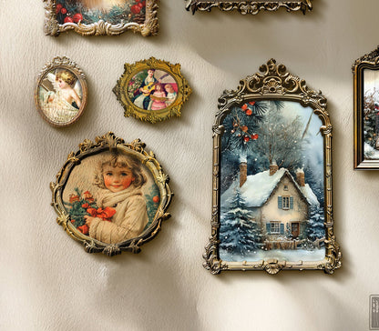 Collection of vintage-style framed artworks on a wall with sunlight casting shadows.