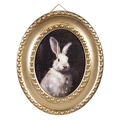 Oval framed picture of a rabbit with a gold beaded border on a white background