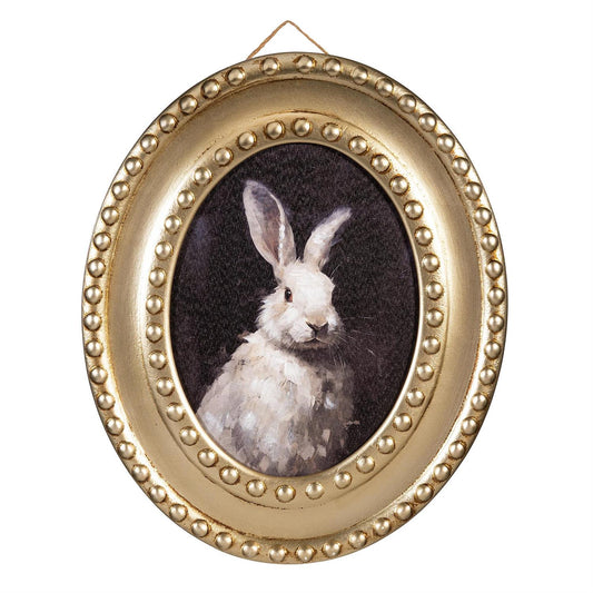 Oval framed picture of a rabbit with a gold beaded border on a white background