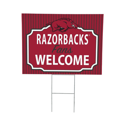Red sign with 'RAZORBACKS Fans WELCOME' text and a pig logo on a white background