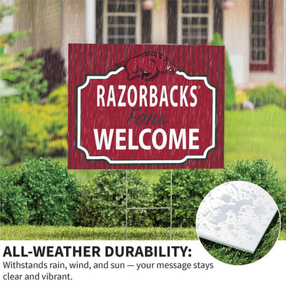 Decorative sign with 'RAZORBACKS Fans Welcome' text in a garden setting.