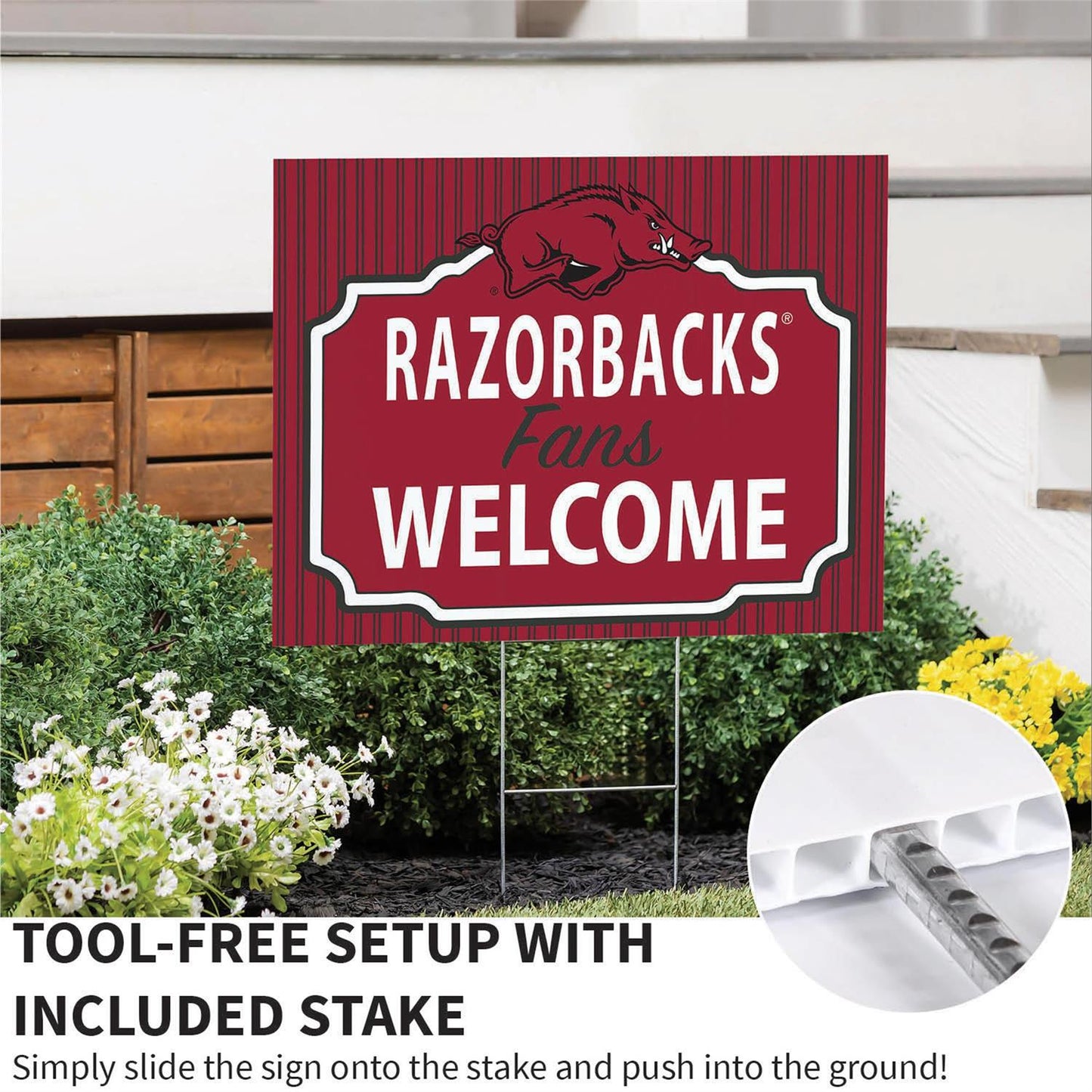 Red 'Razorbacks Fans Welcome' sign with included stake on a grassy area.