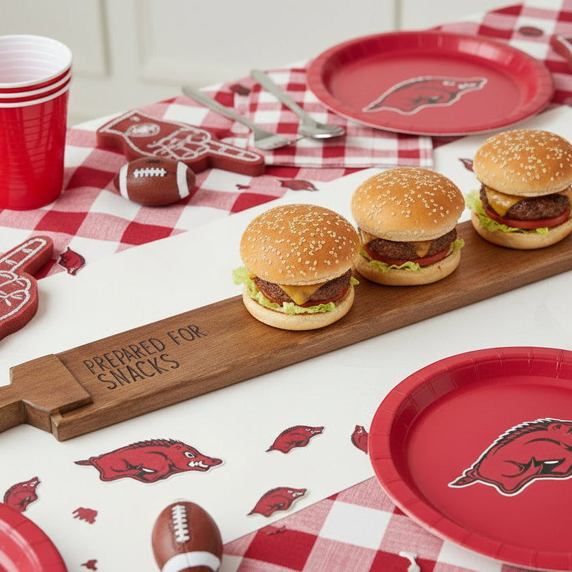 Wooden serving board with 'Prepared for Snacks' text on a gameday able