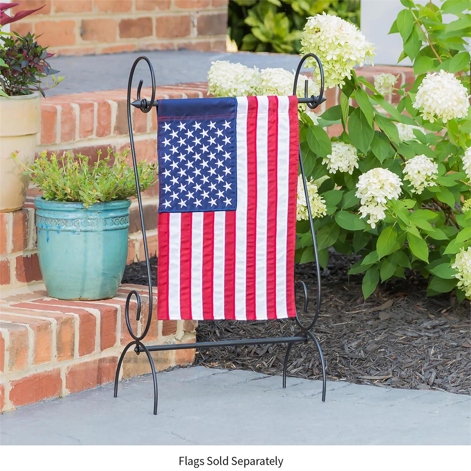 Scroll Garden Flag Stand with American flag in outdoor setting.