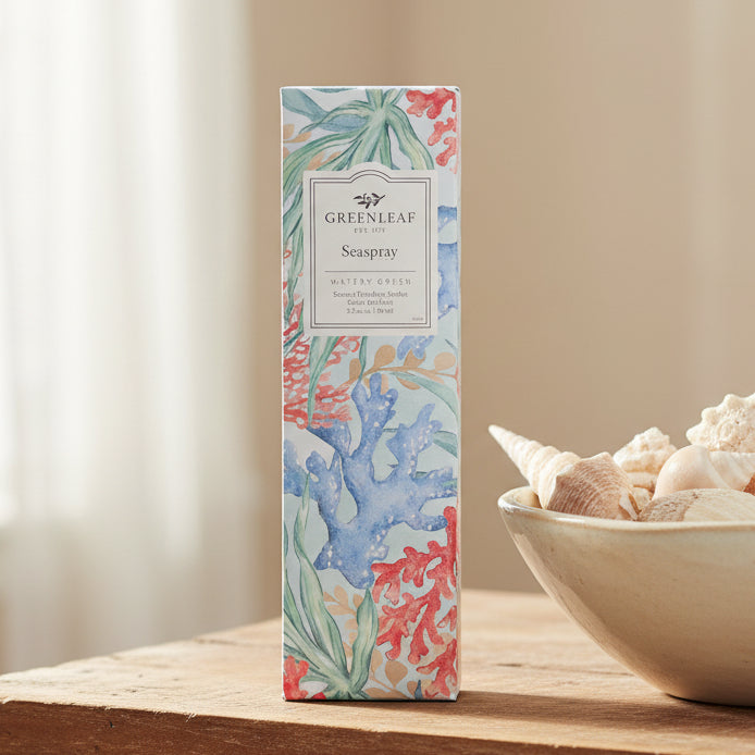 Greenleaf Seaspray slim sachet on a table with a bowl of shells.