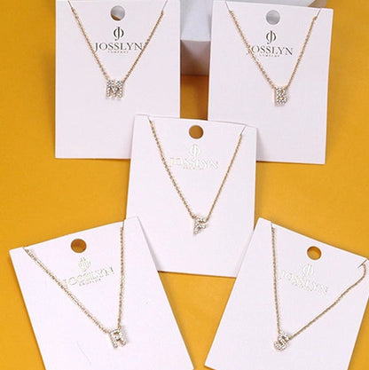 Initial Necklaces on yellow background
