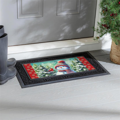 Decorative doormat with a snowman design on a wooden floor in front of a door.