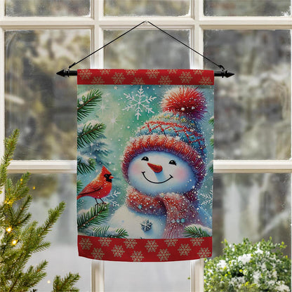 Decorative Christmas flag with a snowman, cardinal, and snowflakes in front of a window.