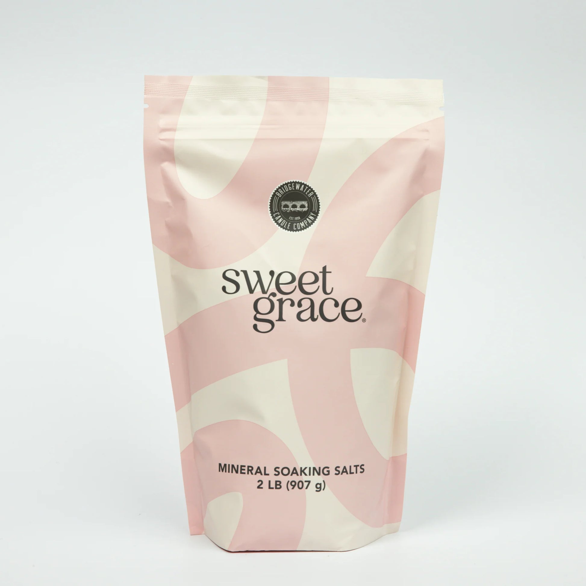 Bag of Sweet Grace mineral soaking salts with pink and beige design on a white background