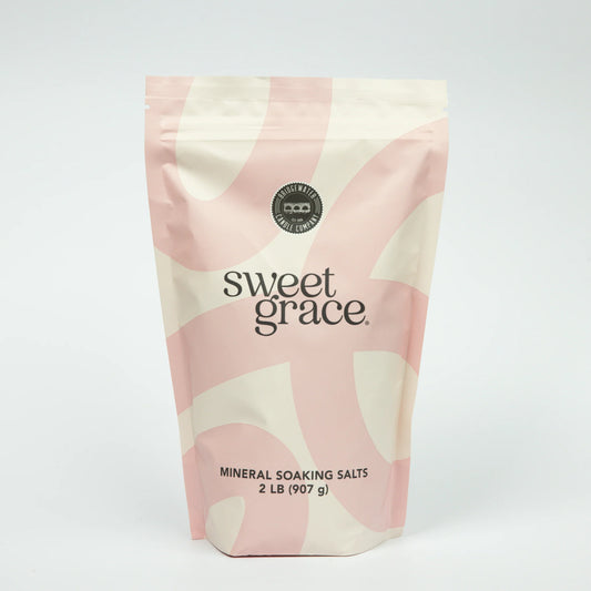 Bag of Sweet Grace mineral soaking salts with pink and beige design on a white background