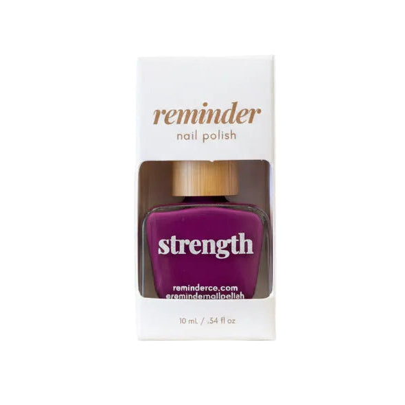 Reminder Nail Polish in Strength Violet Purple in package on a white background.