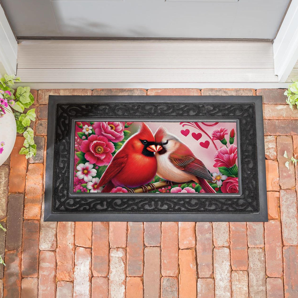 Evergreen Cardinal Lovers switch mat with cardinals and flowers on a brick patio.