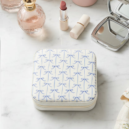 Jewelry box with blue bow pattern on a bathroom counter