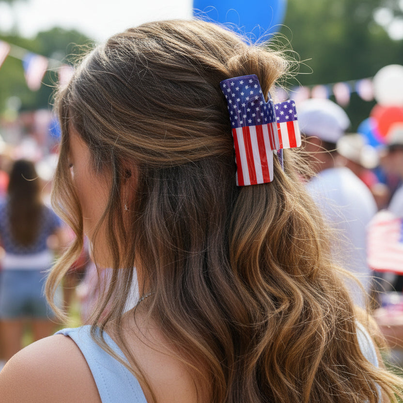 American flag-themed hair clip on a woman's hair at a patriotic event