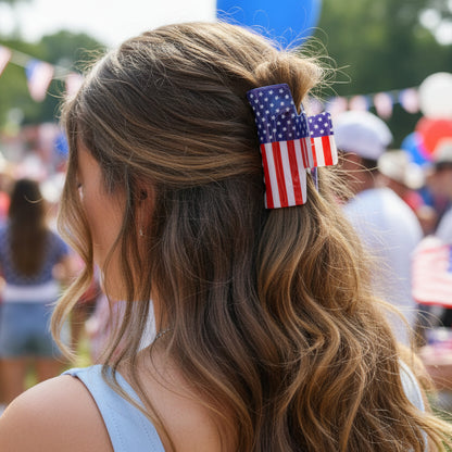 American flag-themed hair clip on a woman's hair at a patriotic event