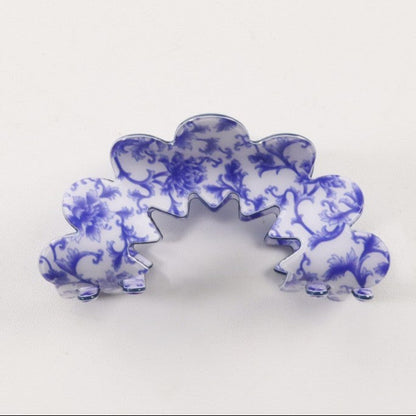 Blue and white porcelain style hair claw on white background