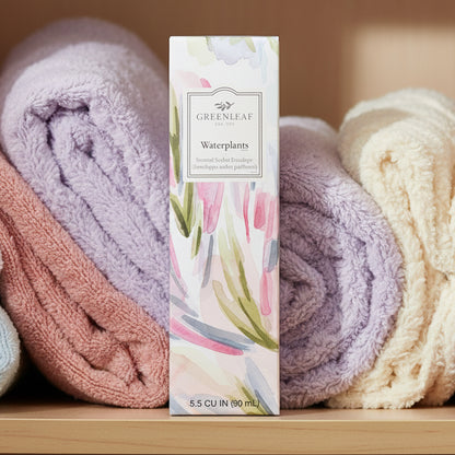 Greenleaf Waterplants slim sachet on a shelf with pastel colored towels.