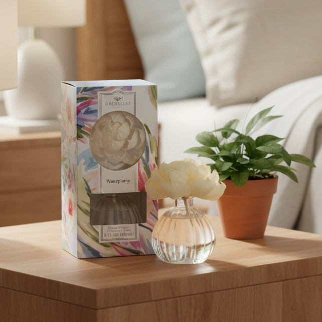 Greenleaf flower diffuser in the scent Waterplants with packaging on a bedroom nightstand