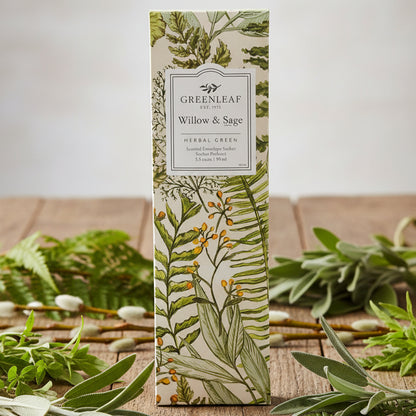 Greenleaf Willow & Sage slim sachet on a rustic table with herbal plants around it.