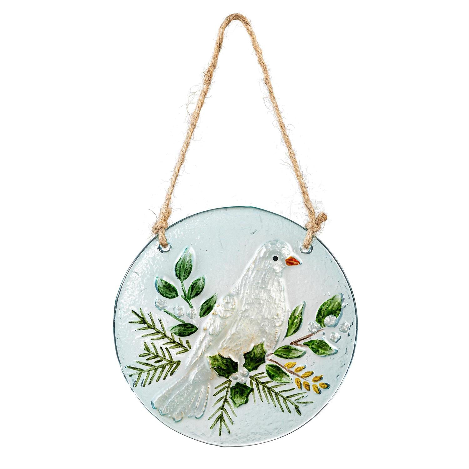 Decorative glass plate with a dove and leaves design, hanging on a white background.