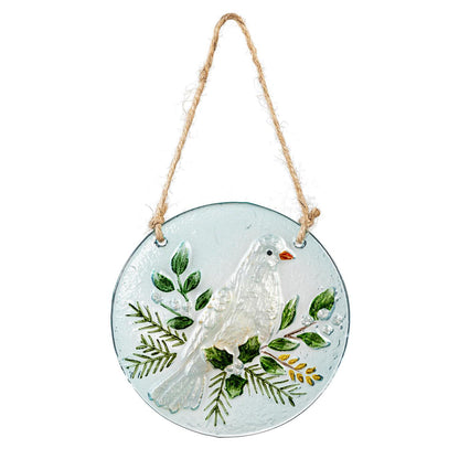 Decorative glass plate with a dove and leaves design, hanging on a white background.