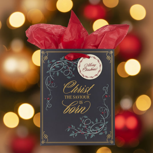 Christmas gift bag with red tissue paper and 'Christ the Saviour is born' text.